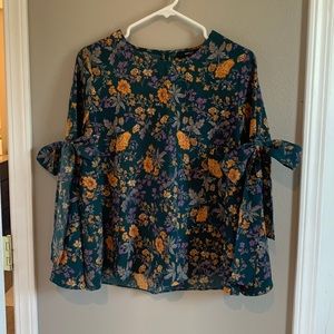 Green floral bell sleeved shirt with bows or arms